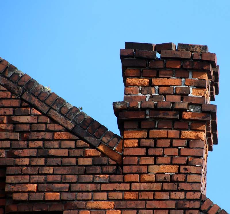 Damaged chimney on an Ferndale home showing cracks and missing mortar